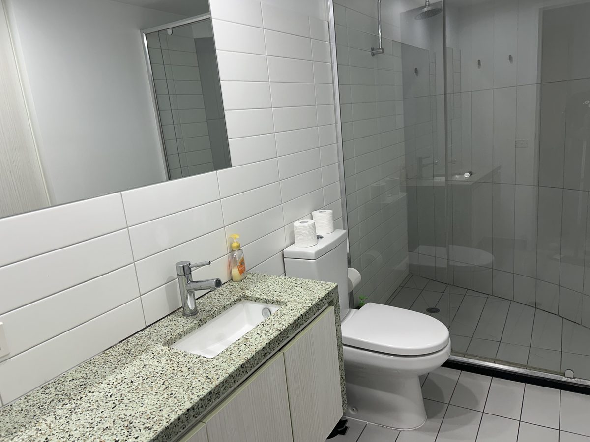 Bathroom tiles, grout and fittings after a deep detail clean